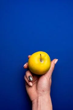 Selective focus, apple in hand Stock Photos