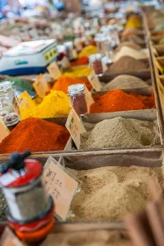 Selective focus on array of spices in trays in typical european market 写真素材