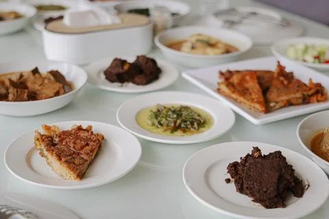 Selective Focus of Authentic Padang Dishes on Dining Table Stock Photos