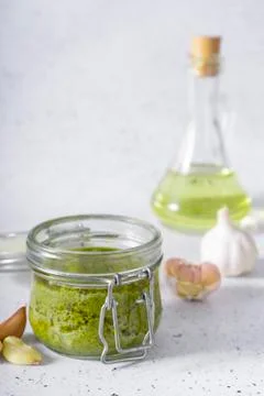 Selective focus. Basil and cheese pesto paste Stock Photos
