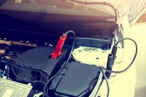 Selective focus to battery cable connector in car engine room for  maintenanc Stock Photos