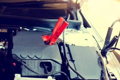 Selective focus to battery cable connector in car engine room for  maintenanc Stock Photos