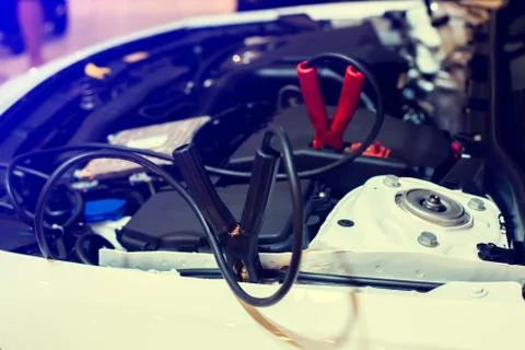 Selective focus to battery cable connector in car engine room for  maintenanc Stockfoto's