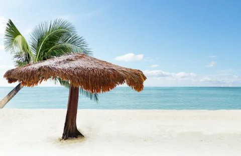 Selective focus beach chairs with umbrella wood and beautiful sand beach with Stock Photos