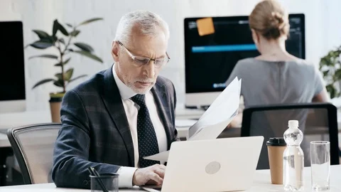 Selective focus of bearded man in eye glasses holding folder Stock Footage 113617800