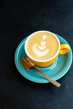Selective focus, beautiful cappuccino mug with a pattern Stock Photos