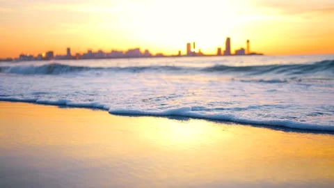 Selective focus a beautiful sea wave on the sand against the backdrop of an Stock Footage 234138436