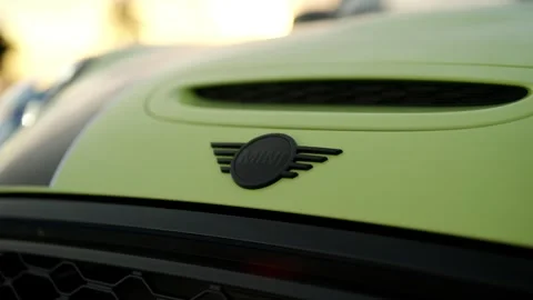 Selective focus on black monochrome front Mini Cooper logo located on light Stock Footage 261247527