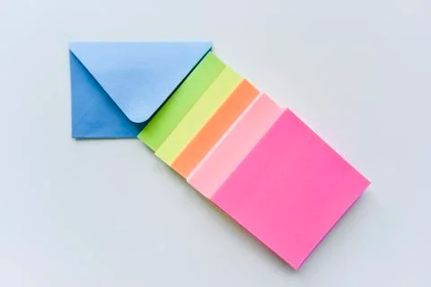 Selective focus, blue envelope in the center with colored rectangles directed Stock Photos