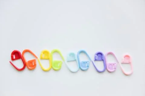 Selective focus with blurry effect at colored safety pins Stock Photos