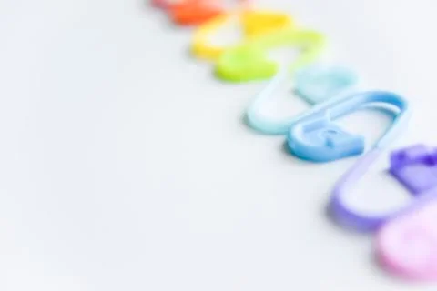 Selective focus with blurry effect at colored safety pins Stock Photos