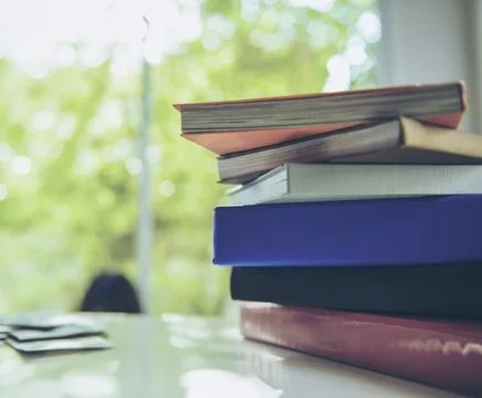 In selective focus of Book pile on table Stock-Fotos