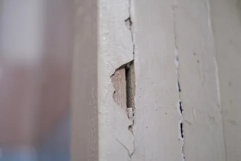 Selective focus, broken, old, ruined wall, cracked plaster in an abandoned ap Stock Photos