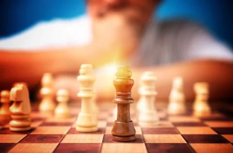 Selective focus of brown king chess and background of businessman thinking st Stock Photos