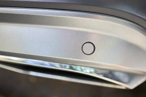 Selective focus on bumper right side parking sensor at back of luxurious car Stock Photos
