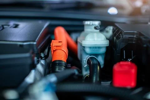 Selective focus to cable battery and engine radiator level measuring tank i.. Stock Photos