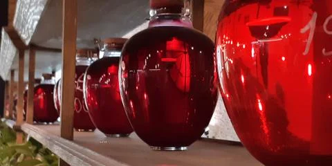 Selective focus. Canned fruit drinks in glass jars. Compote of berries in jars Stock Photos