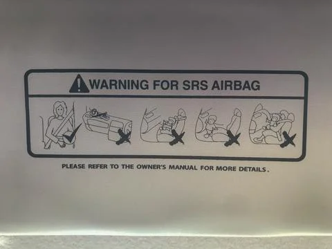 Selective focus of car alert warning sign for SRS AIRBAG Stock Photos