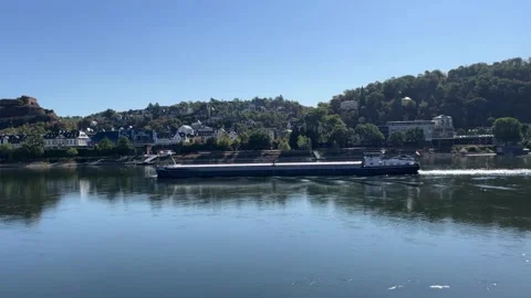 Selective focus cargo barge sailing along the Rhine River in Koblenz Germany Stock Footage 344930636