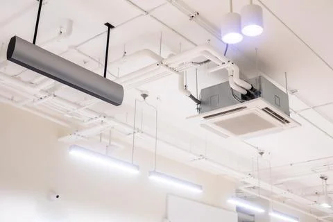 Selective focus to ceiling mounted cassette type air condition units with o.. Stock Photos