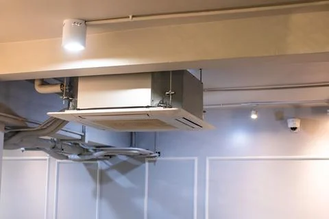 Selective focus to Ceiling mounted cassette type air condition units with o.. 스톡 사진