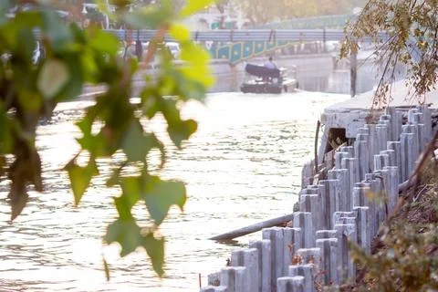 Selective focus to cement or concrete pillar, pole on along the canal site. Stock Photos