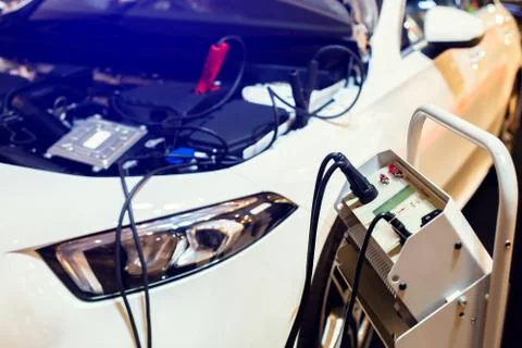 Selective focus to charger machine connect to car battery for  maintenance se Stock Photos