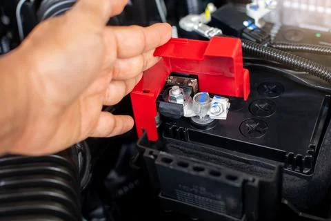 Selective focus to check and maintenance the battery in car with yourself. Stock Photos