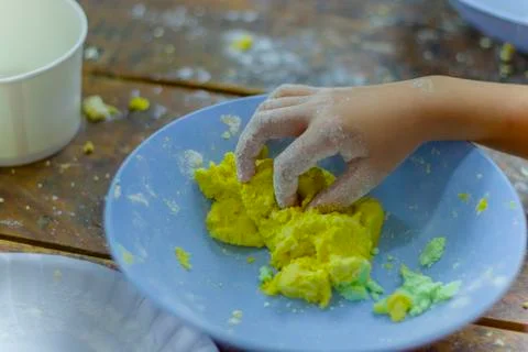 Selective focus of children preparing dough for cooking Thai dessert. Stock Photos