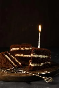 Selective focus, chocolate sponge cake with birthday candle Stock Photos