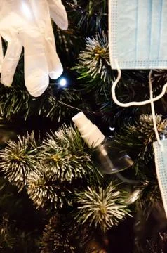 Selective Focus Christmas tree decorated with sanitizer, protective mask. Stock Photos