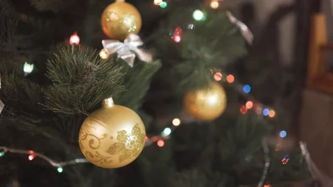 Selective focus on Christmas tree decoration. Christmas lights on the tree. Stock Footage 127493543