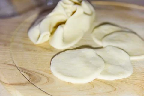 Selective focus at circle shapes cut out from the dough for dumplings Stock Photos
