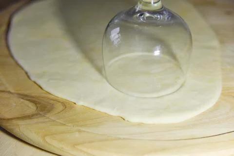 Selective focus at circle shapes cut out from the dough for dumplings Stock Photos