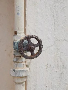 Selective focus on the circular knob of metal pipe Stock Photos