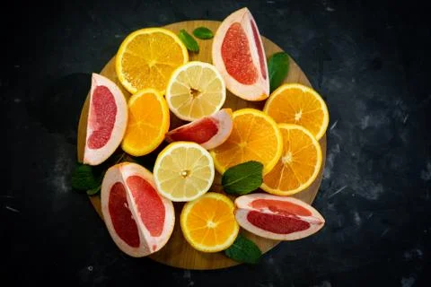 Selective focus, citrus fruit on dark background Stock Photos