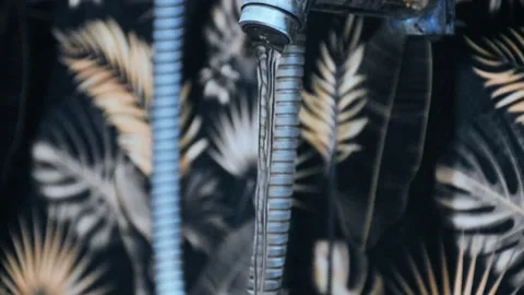 Selective focus of clean water flowed from the faucet Stock Footage 236746183