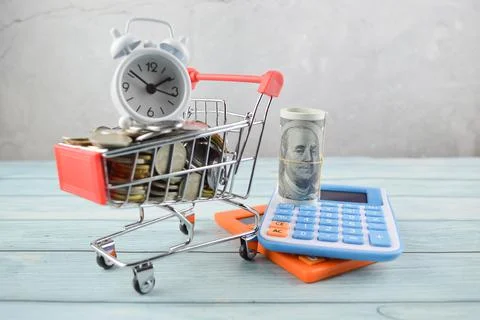 Selective focus of clock, money banknotes and calculator. Financial concept Stock Photos