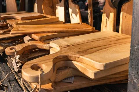 Selective focus close-up of artisan handmade wooden cutting boards kitchen Stock Photos