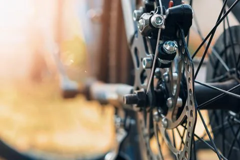 Selective focus Close-up of a bicycle disc brake system, highlighting the r.. Stock Photos