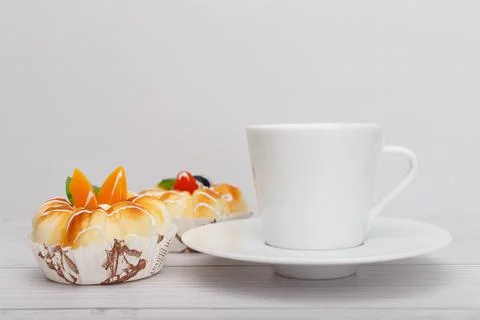 Selective focus, close up of coffee cup with tea cakes Stock Photos
