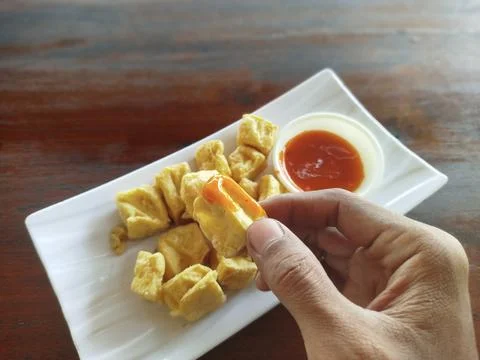 Selective focus close up crispy diced fried tofu Фото