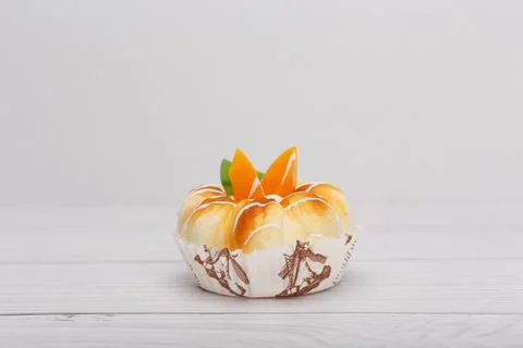 Selective focus, close up of cupcake with fruit pieces on wooden table with Stock Photos