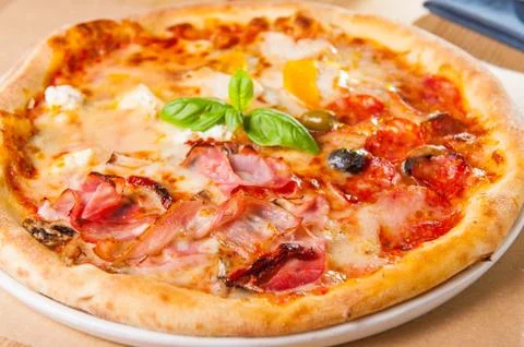 Selective focus close up Delicious Meat Pizza with bacon and sausages on whit Stock Photos