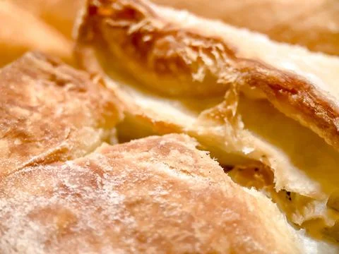 Selective focus close-up of freshly baked yeast, puff dough strudel. Pastries Stock Photos