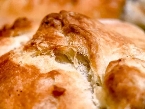Selective focus close-up of freshly baked yeast, puff dough strudel. Pastries Stock Photos