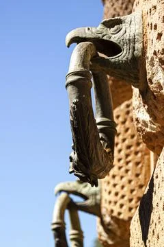 Selective focus close up image of Statues of an an eagle's head carrying a do Stock Photos