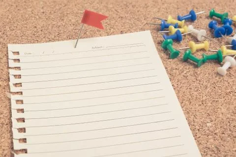 Selective focus close up on red flag pin on line paper with multiclor pins on Stock Photos