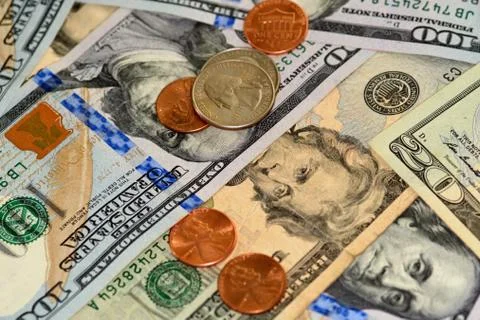 Selective focus close up of us banknotes and coins Stock Photos
