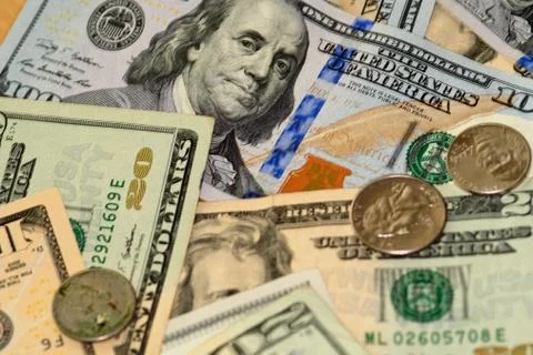 Selective focus close up of us banknotes and coins Stock Photos